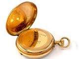 an image of a gold pocket watch on a white background