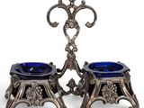 a pair of silver and blue glass candlesticks on stands