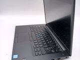 a laptop with a black keyboard on a white surface