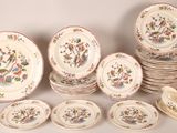 a lot of plates that are sitting on a table