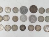 an image of a group of coins sitting on top of a white surface