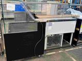 a large display case in the middle of a warehouse