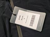an image of a luggage tag attached to a jacket