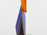a glass sculpture with a blue and orange design on top of it