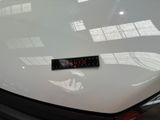 a remote control on the hood of a car
