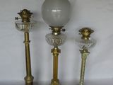 three lamps that are sitting next to each other on a table
