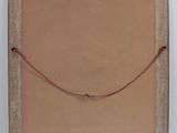 an old picture frame with a string hanging from it ' s side