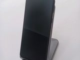 a cell phone that is sitting on top of a stand