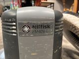 a trash can that is sitting on the floor