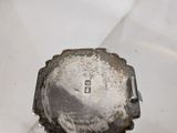 a small metal object that is sitting on a table