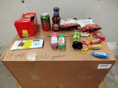 a cardboard box with a bunch of items on top of it