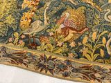 a picture of a tapestry with animals and birds on it
