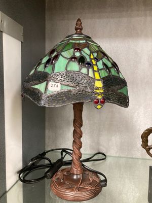 a lamp that is sitting on a glass table