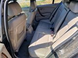 the back seats of a car are empty and the passenger seat is empty