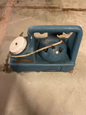a blue propanene sitting on the floor in a room