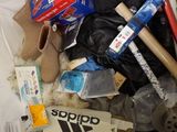 a bag full of items that are sitting on a bed