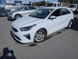 the white car is parked in the parking lot near other cars