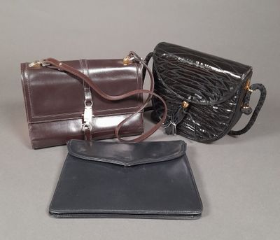 three purses that are sitting on a table