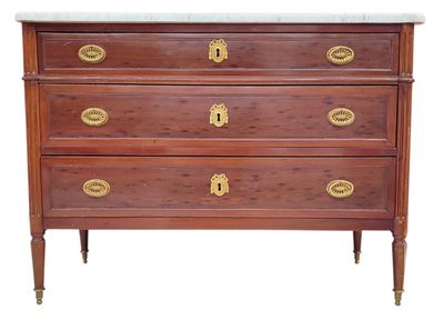 a wooden chest of drawers with a marble top