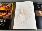 three books that are sitting on a table