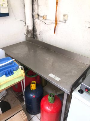 an image of a kitchen area with a stove and a table