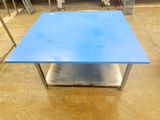 a blue table that is sitting on the floor