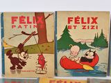 several children ' s books are lined up on a table