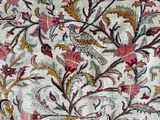 a close up of a rug with a floral design on it