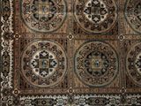 a rug that has a lot of different designs on it