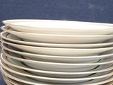 several plates stacked on top of each other on a table