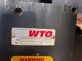 a close up of a machine with a warning sign on it