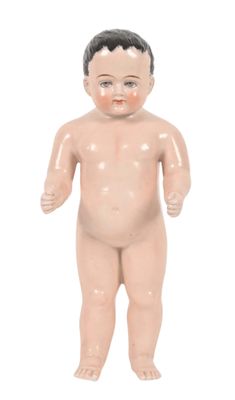 a small plastic doll of a baby with a black hair