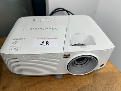 an image of a projector sitting on top of a wooden table