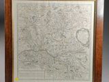 a framed map of the city of london in a wooden frame