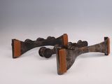 two pieces of wood that are sitting on a table
