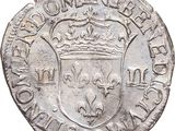 an old silver coin with a crown on top of it