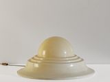 a white lamp that is on a white table