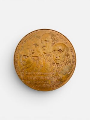 une image représentant une pièce d'or sur laquelle figure un groupe de personnes