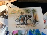 a drawing of a boy and a dog on a table