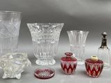 a lot of glass vases that are sitting on a table