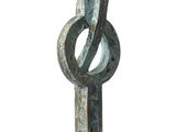 a metal sculpture of a number one on a pedestal