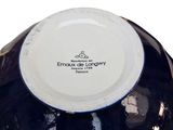 a black and white bowl with a white lid