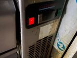 a dirty refrigerator in a dirty kitchen with a dirty floor