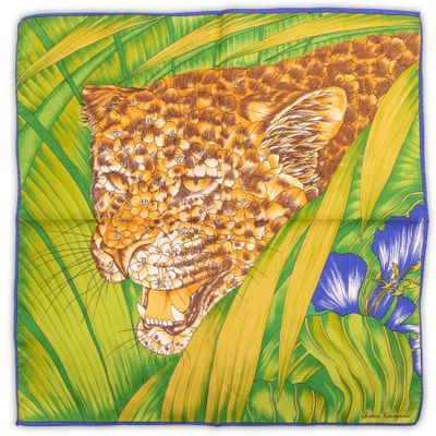 a close up of a painting of a leopard in the grass