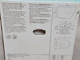 packaging for a toilet in a box on a white surface