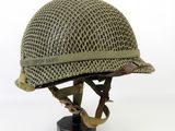 a close up of a helmet on a stand on a white background