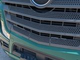 a close up of a green mercedes truck with yellow lettering on it