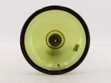 a green glass vase with a black rim on a white surface