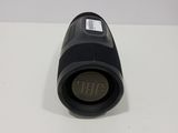 a close up of a black speaker on a white surface