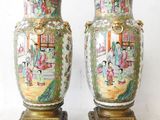pair of antique chinese vases on stands with asian scenes